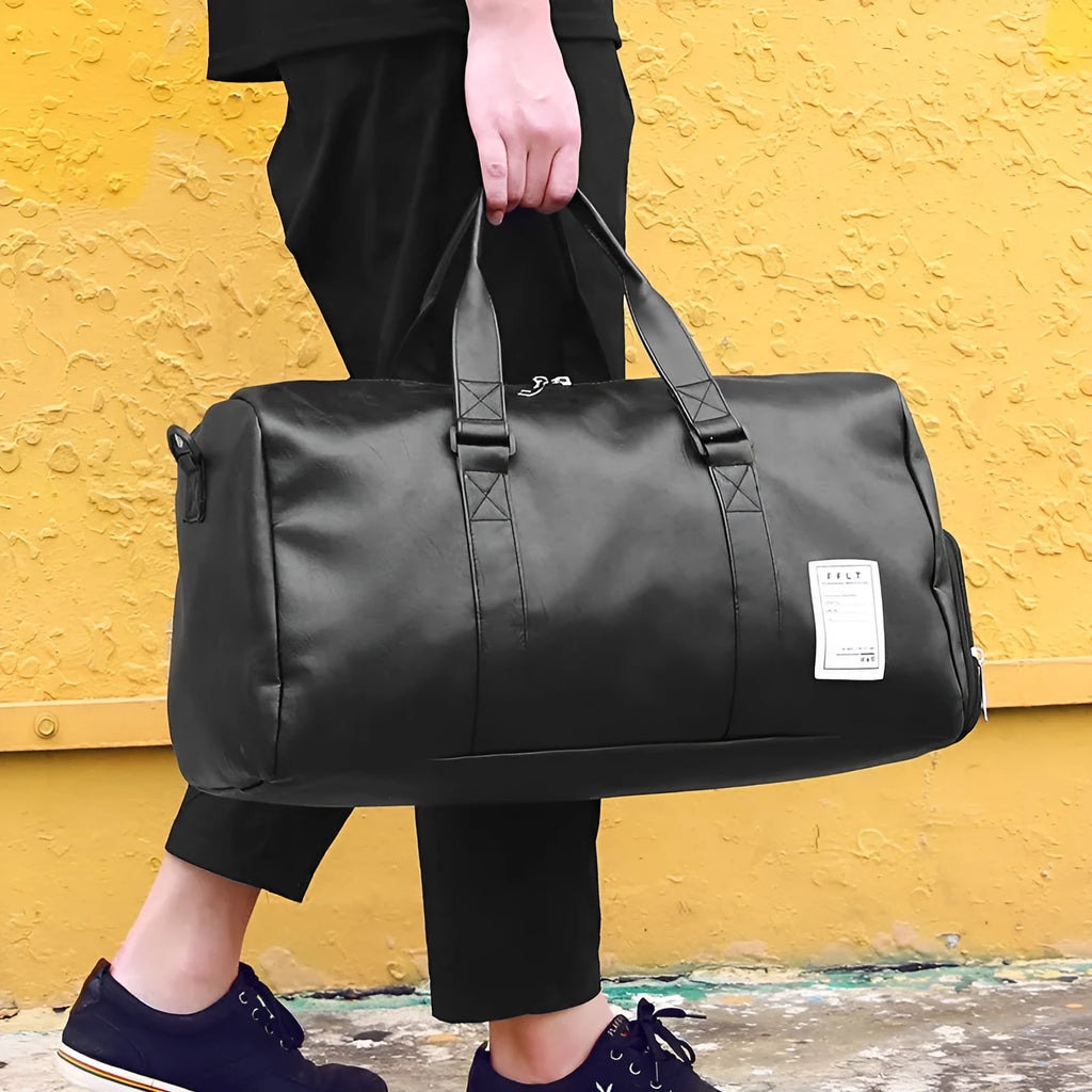 Black waterproof sports bag with diagonal strap and separate shoe compartment