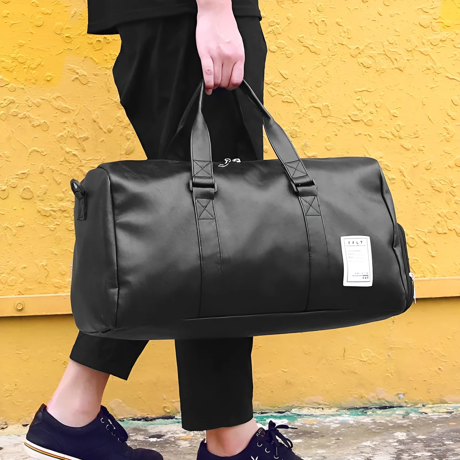 Black waterproof sports bag with diagonal strap and separate shoe compartment