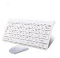 Black wireless keyboard and mouse set on wooden desk showing 2.4GHz wireless operation