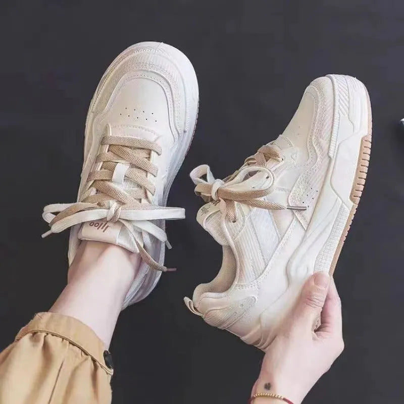 Women's pink and white low-top sneakers with a rubber sole, shown in sizes 35 to 40.