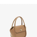 Women's leather wing handbag in blue with buckle decoration and shoulder strap