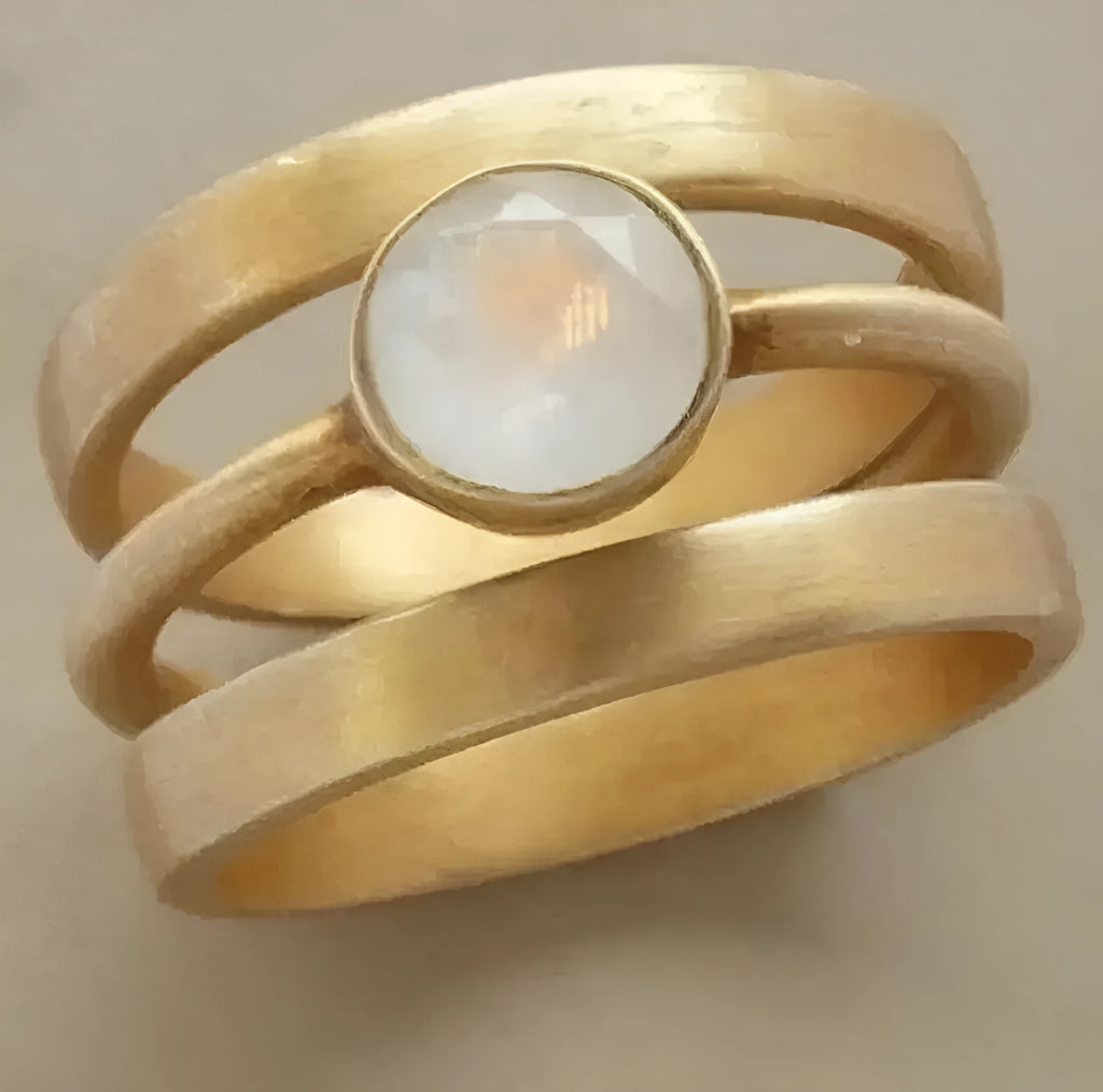 Gold geometric ring with hollow white chalcedony inlay on titanium steel band