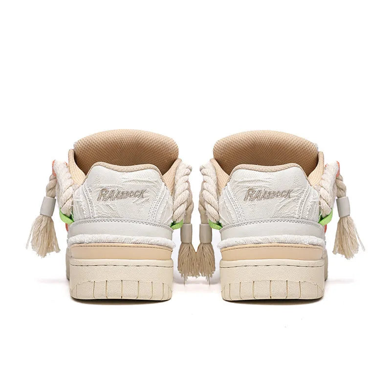 Creamy white low-top retro skate shoes with platform heel and lace-up design on a plain background.