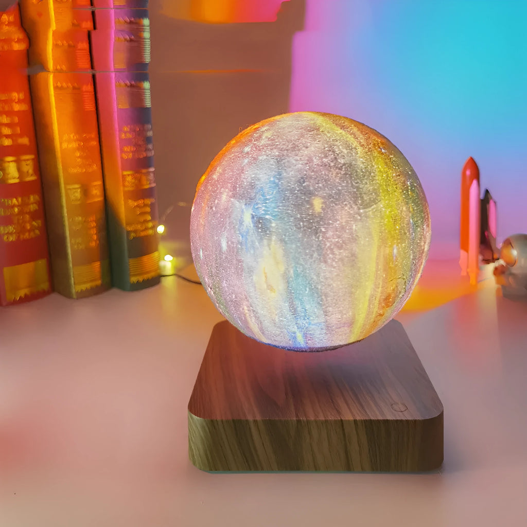 Magnetic levitation galaxy decorative light with rotating moon lamp above walnut-coloured circular base