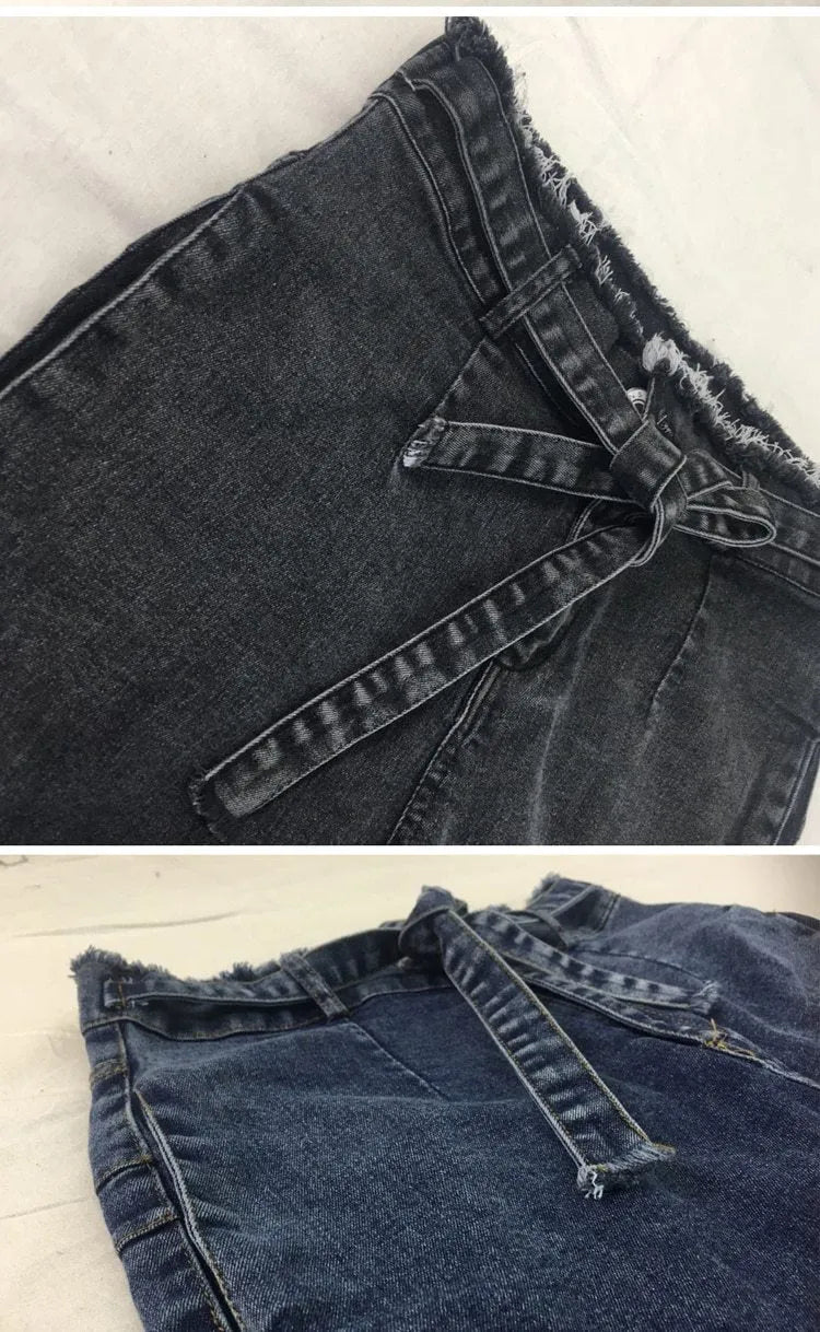 A pair of dark blue fringed jeans made from cowboy denim on a mannequin