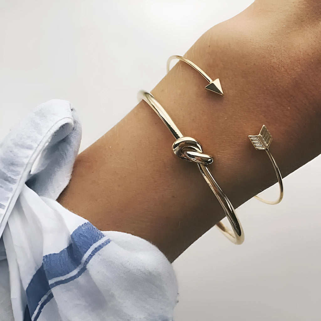 Gold vintage cuff bracelet with knotted arrow design for women