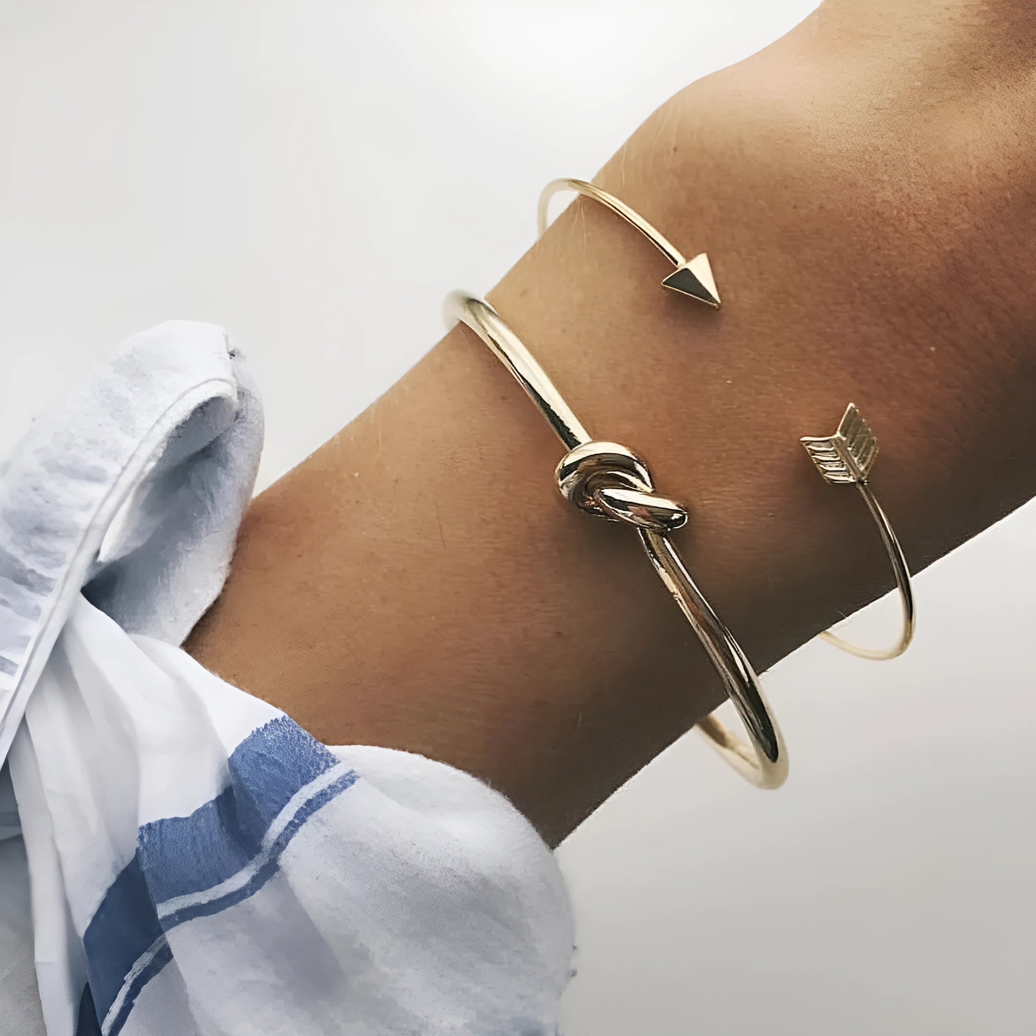 Gold vintage cuff bracelet with knotted arrow design for women