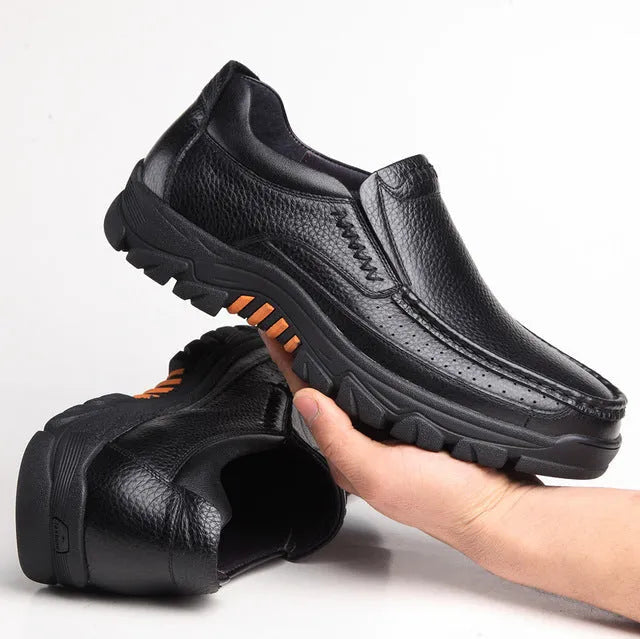Men's black and brown business casual slip-on shoes made of cowhide leather with a rubber sole.