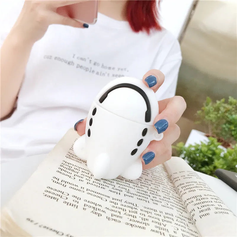 Silicone protective case for Apple AirPods with flip-top cover, cartoon aeroplane headset design, and detachable hook.