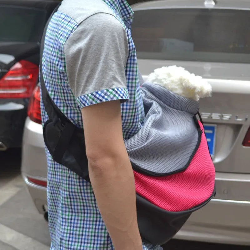 Polyester pet backpack carrier for a small dog, shown in blue colour.