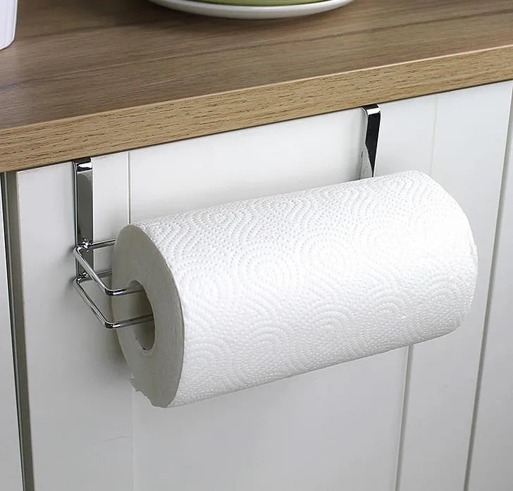Silver stainless steel paper towel rack mounted on a kitchen cabinet door.