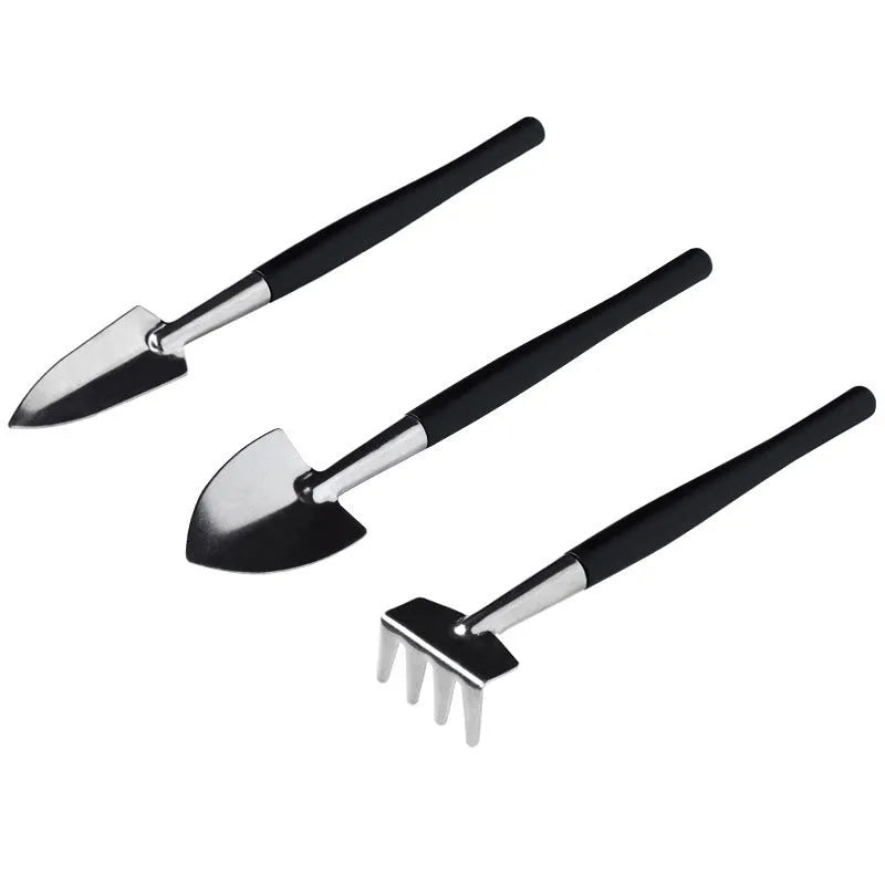 Black mini garden tool set for succulents with 15 tools including shovel, tweezers, watering bottle, and a square cushion.