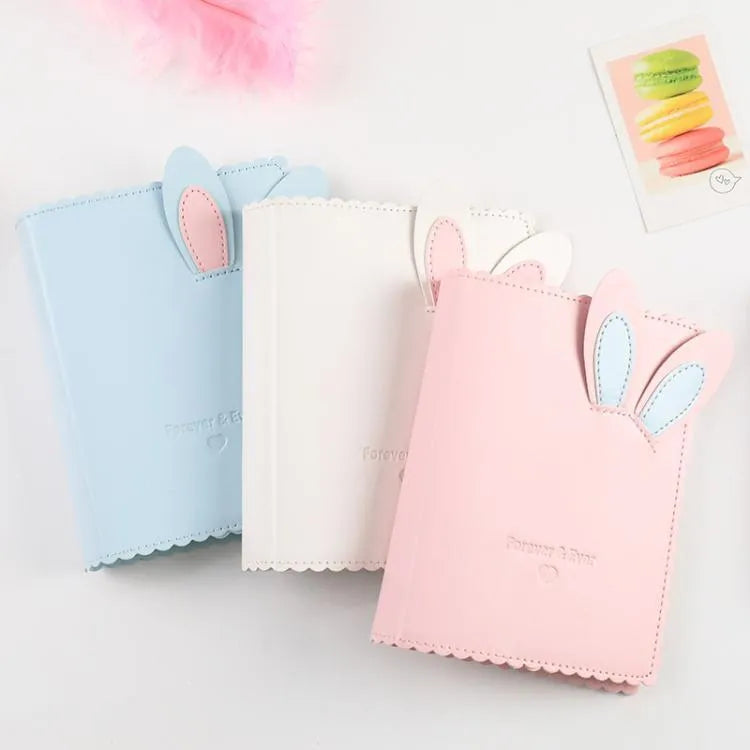 Cute rabbit-themed mini photo album with PU cover in pink, blue, or white, showing loose-leaf pages for 3-inch prints.