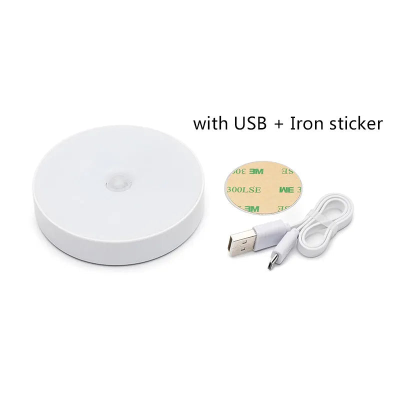 White motion sensor LED night light with USB charging port and adhesive backing