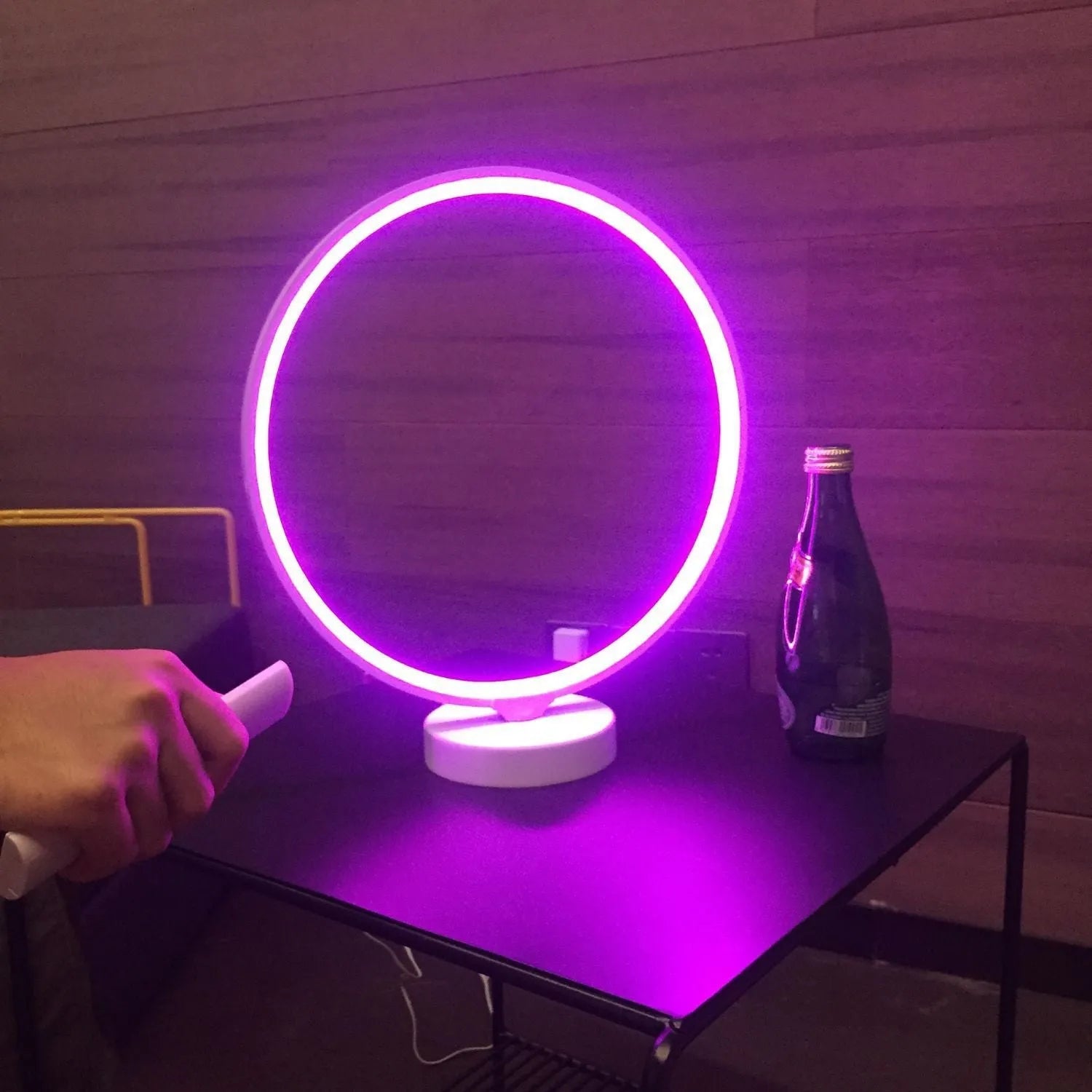 White Full Moon mood lamp on a table with remote control, showing soft ambient glow.