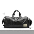 Large black PU leather sports training bag showing multiple zippered pockets and a single shoulder strap.