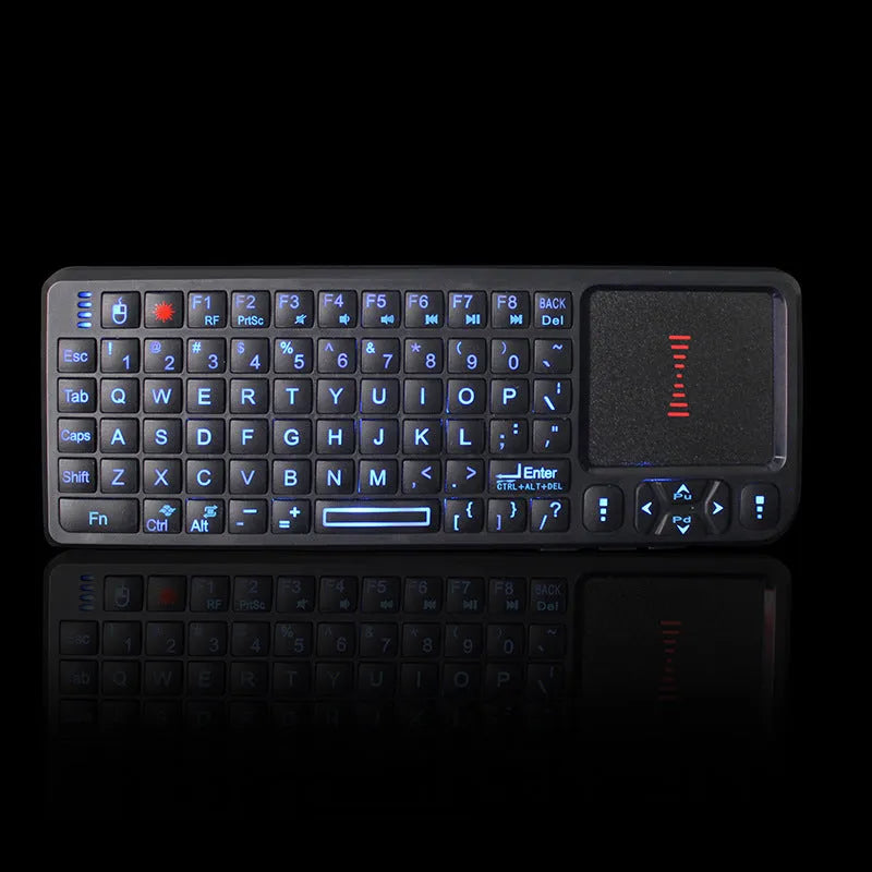 Black wireless mini keyboard with touch screen and optical mouse on desk