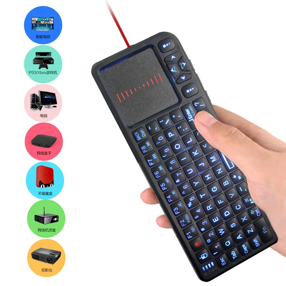 Black wireless mini keyboard with touch screen and optical mouse on desk