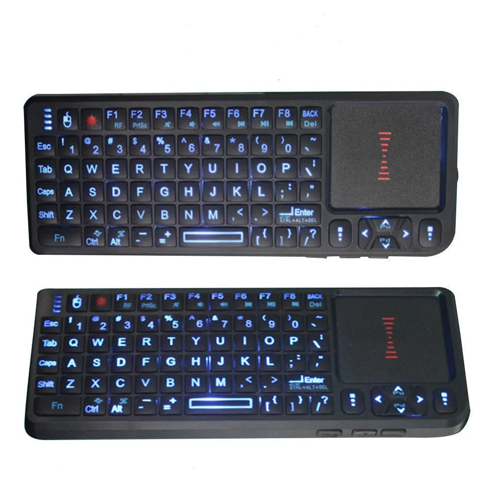 Black wireless mini keyboard with touch screen and optical mouse on desk