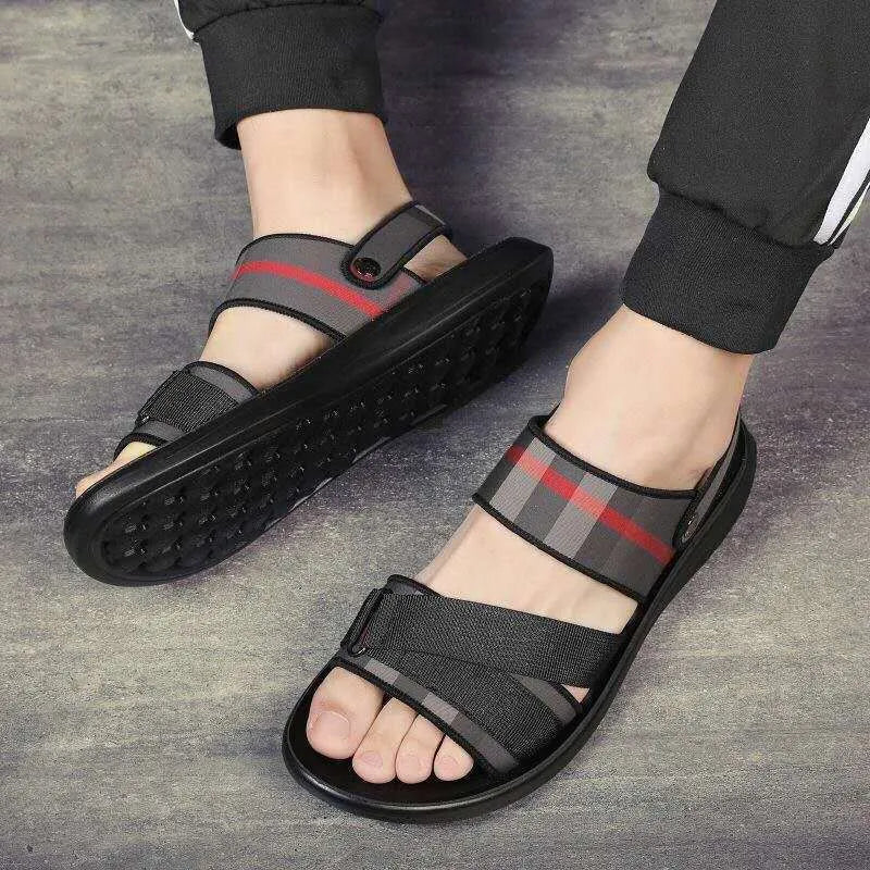 A pair of youth sports sandals with a Lycra upper and polyurethane sole on a light background.