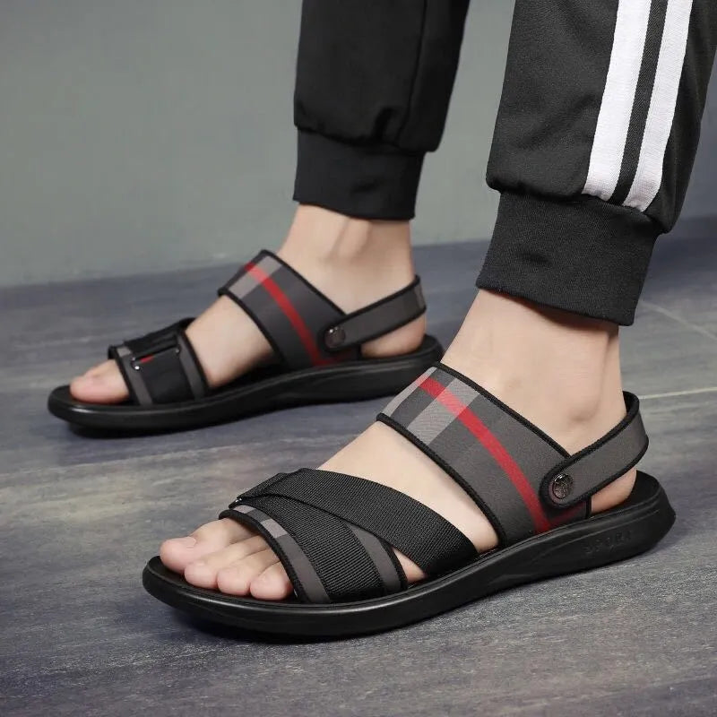 A pair of youth sports sandals with a Lycra upper and polyurethane sole on a light background.