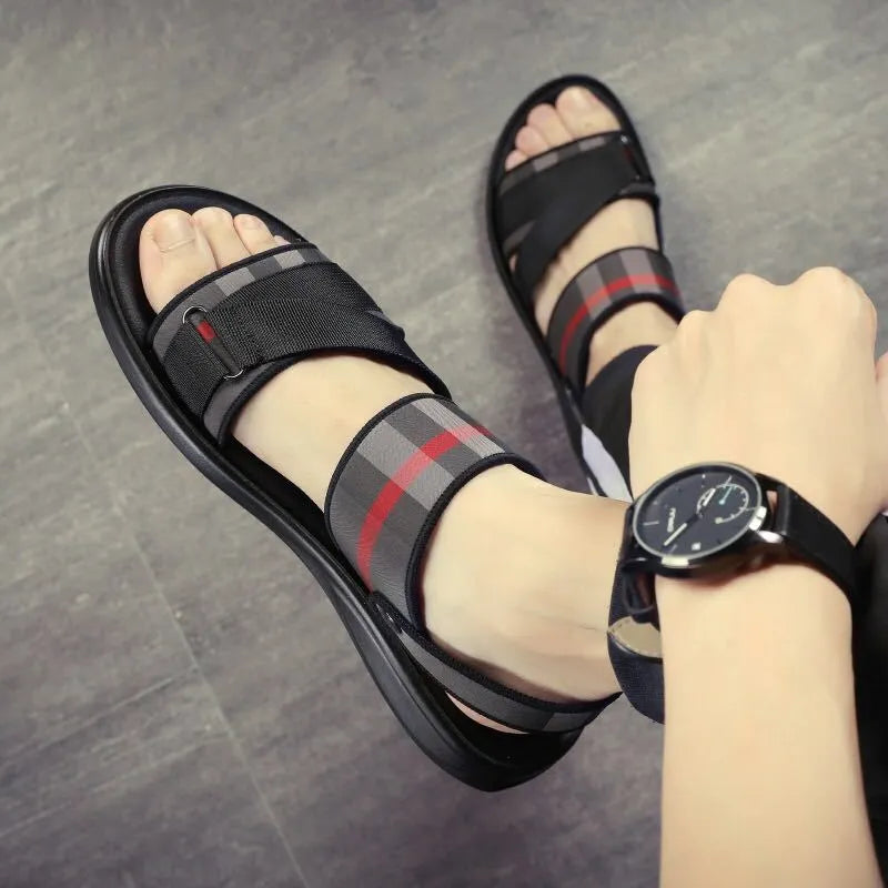 A pair of youth sports sandals with a Lycra upper and polyurethane sole on a light background.
