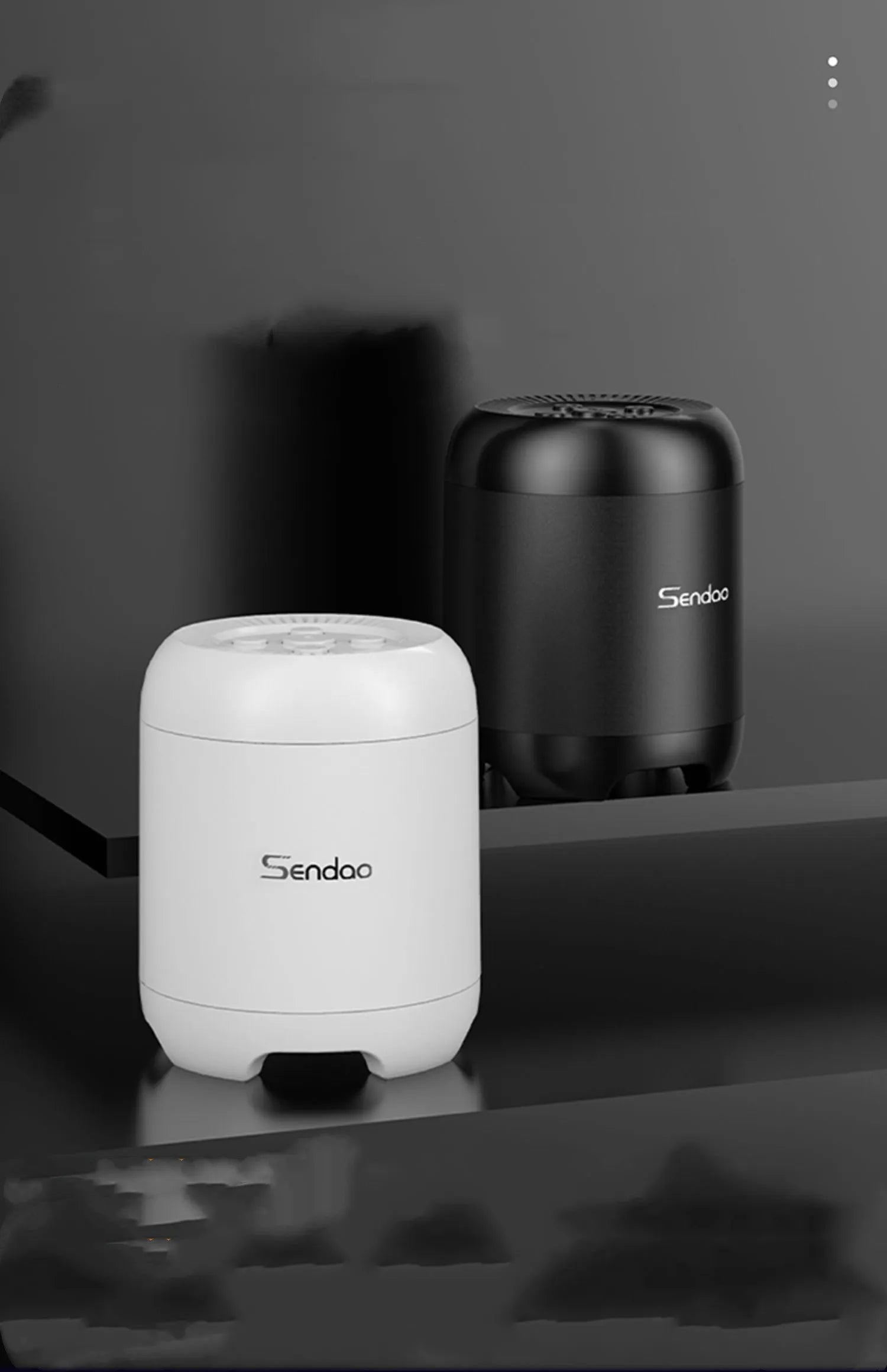 Small black or white wireless Bluetooth speaker with USB port and card reader slot measuring 90x73x73mm