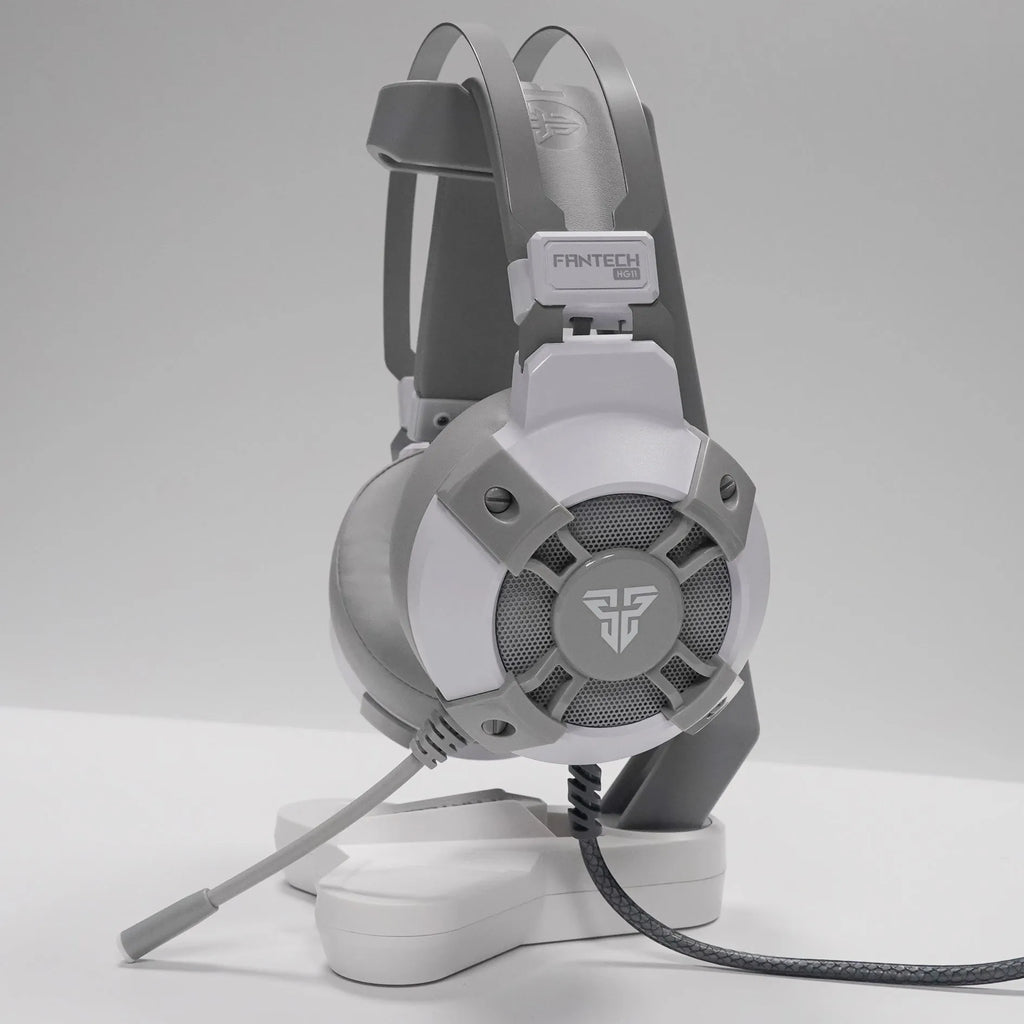 Black FANTECH HG11 over-ear gaming headset with RGB lighting on the earcups and a USB cable.