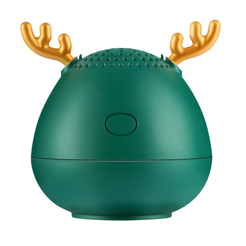 Small green Bluetooth speaker on a table showing its compact size.