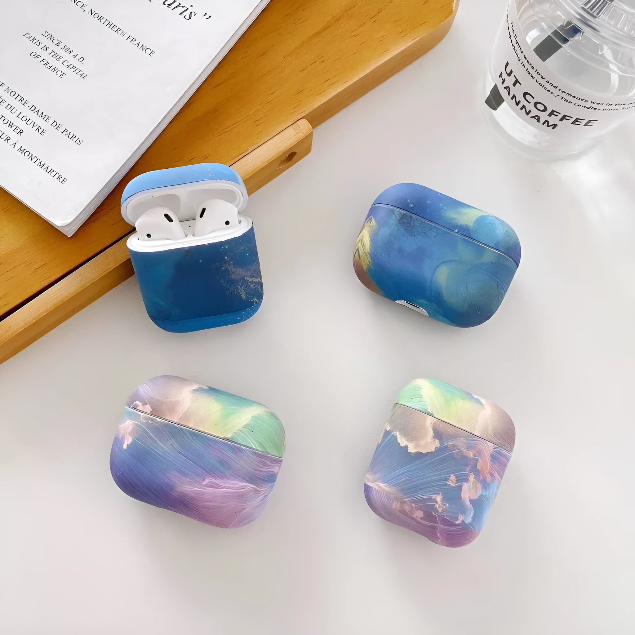 Pink and blue watercolour design plastic protective sleeve for AirPods Pro and AirPods 1/2 charging case.