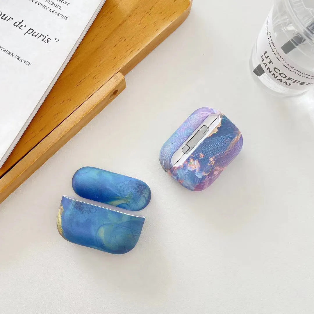 Pink and blue watercolour design plastic protective sleeve for AirPods Pro and AirPods 1/2 charging case.