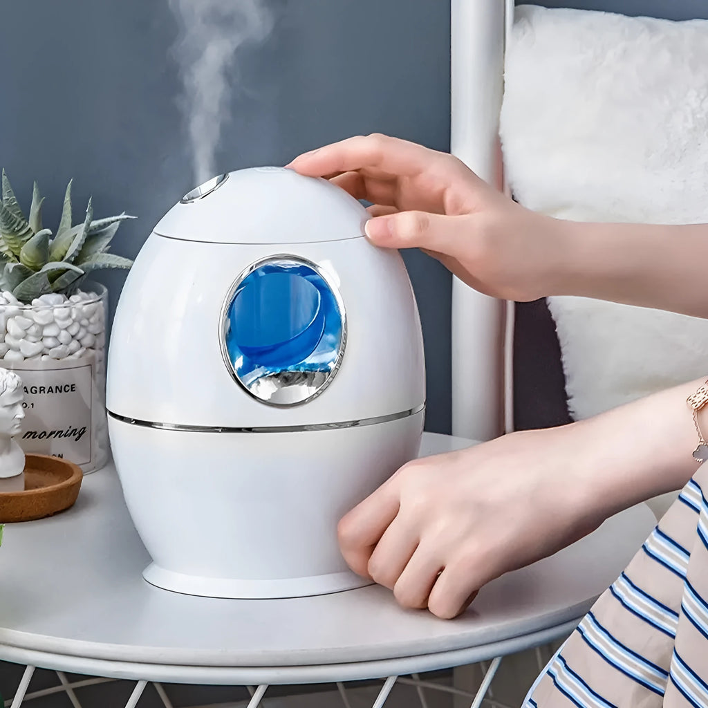 White round USB aromatherapy humidifier with 800ml water tank showing mist output