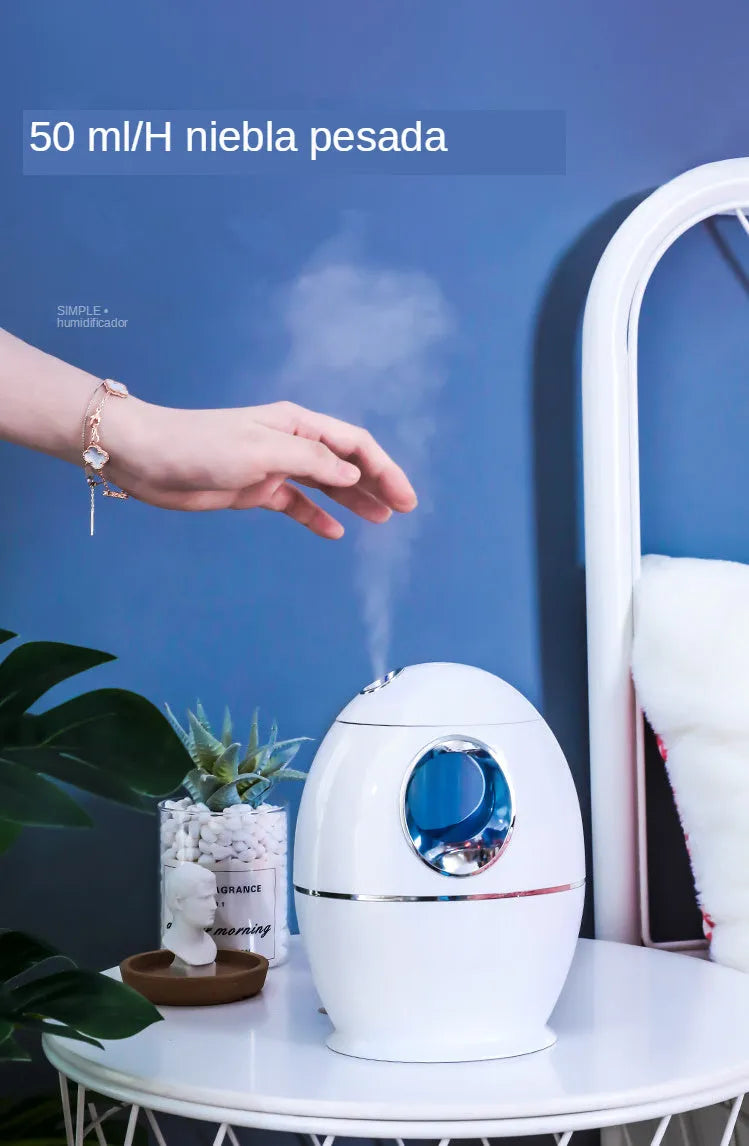 White round USB aromatherapy humidifier with 800ml water tank showing mist output