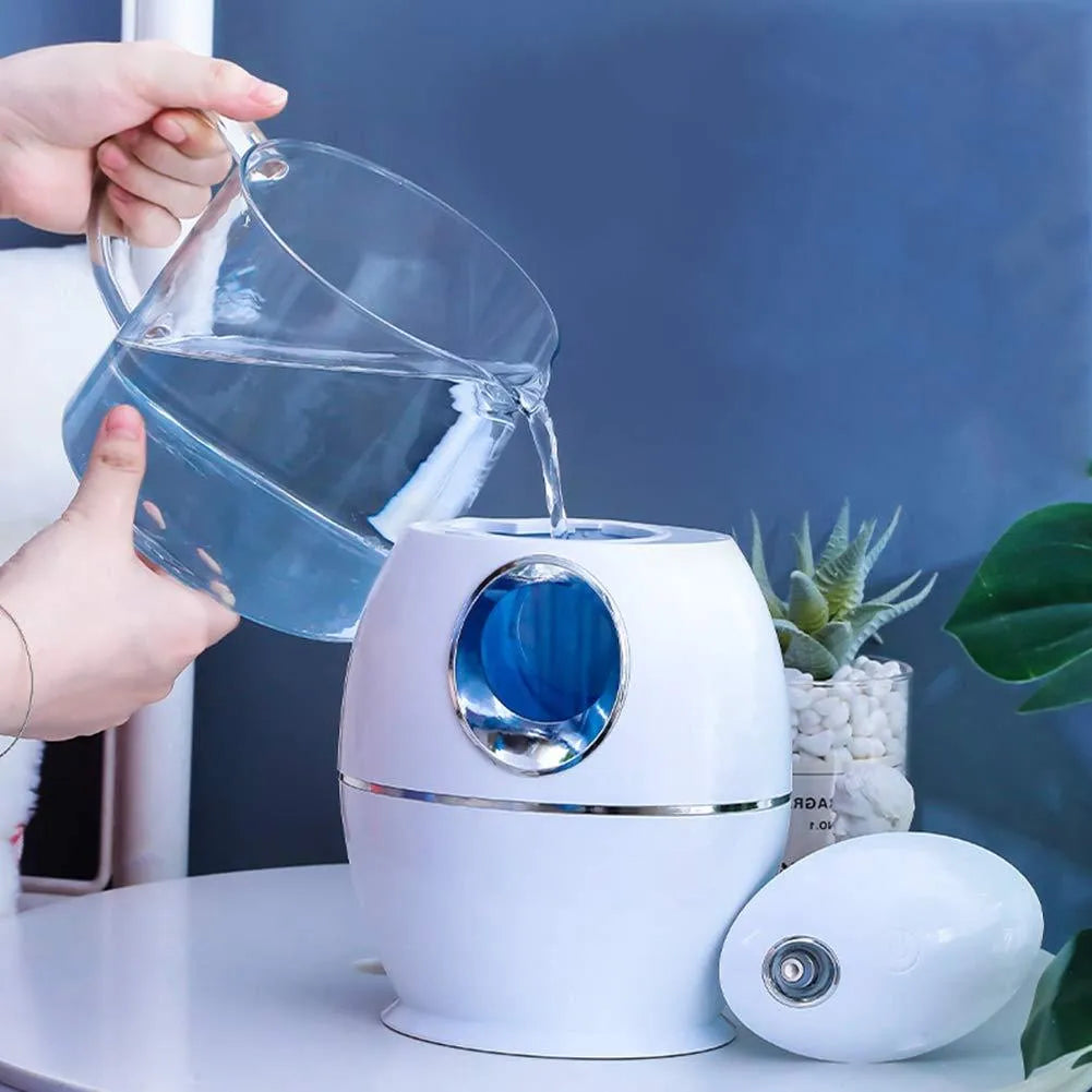 White round USB aromatherapy humidifier with 800ml water tank showing mist output