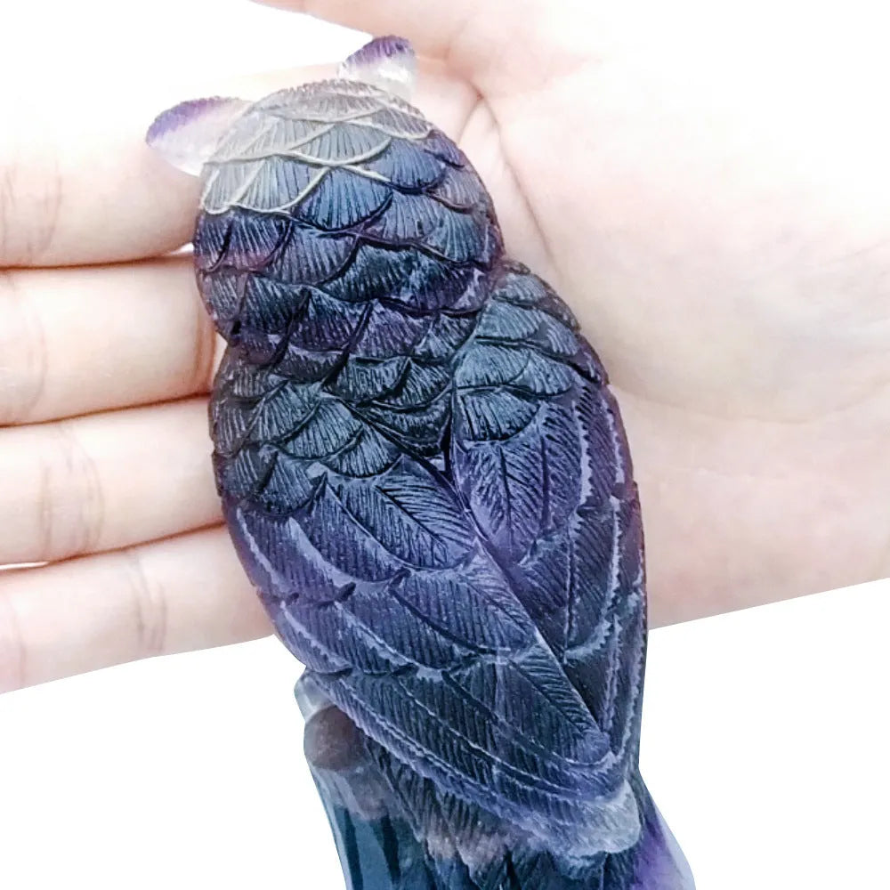 Hand carved purple fluorite owl ornament approximately 4 inches tall with natural stone texture