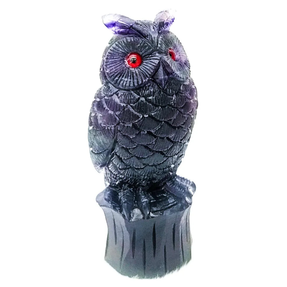 Hand carved purple fluorite owl ornament approximately 4 inches tall with natural stone texture