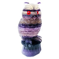 Hand carved purple fluorite owl ornament approximately 4 inches tall with natural stone texture