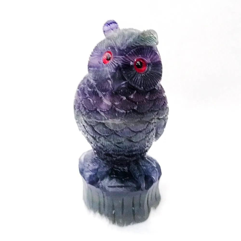 Hand carved purple fluorite owl ornament approximately 4 inches tall with natural stone texture