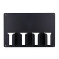 Black plastic wall-mounted storage rack holding four hair clippers