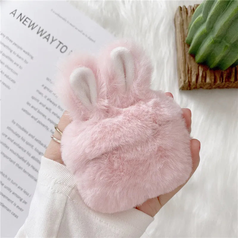 Soft pink silicone AirPods Pro case with cute plush rabbit ears.