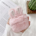 Soft pink silicone AirPods Pro case with cute plush rabbit ears.