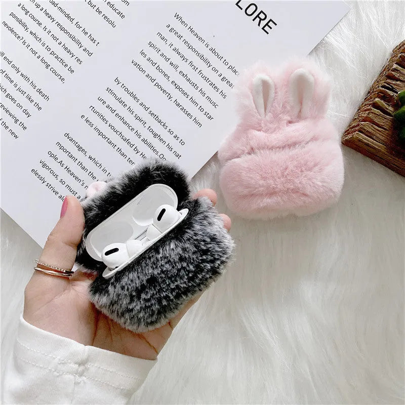 Soft pink silicone AirPods Pro case with cute plush rabbit ears.