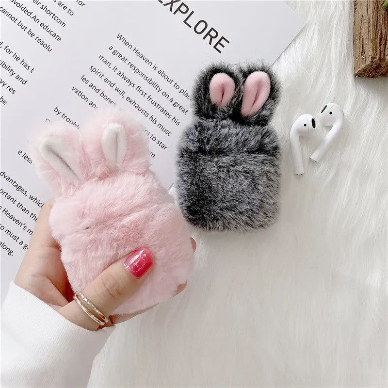 Soft pink silicone AirPods Pro case with cute plush rabbit ears.