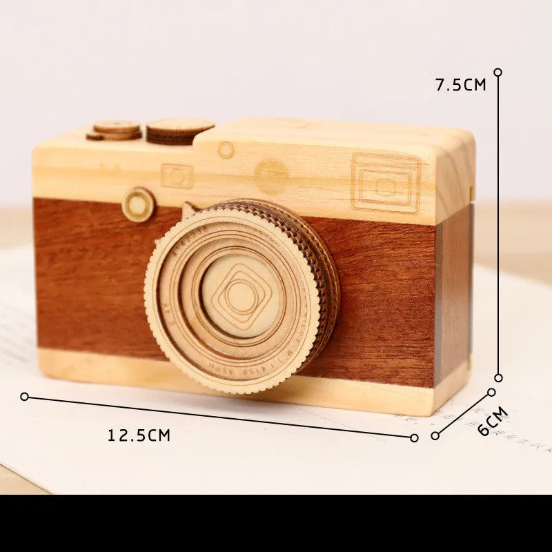 Wooden camera music box with rotating mechanism on pine wood base