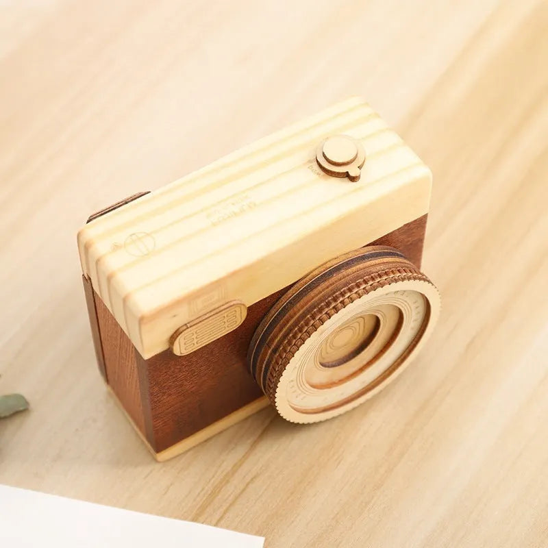 Wooden camera music box with rotating mechanism on pine wood base