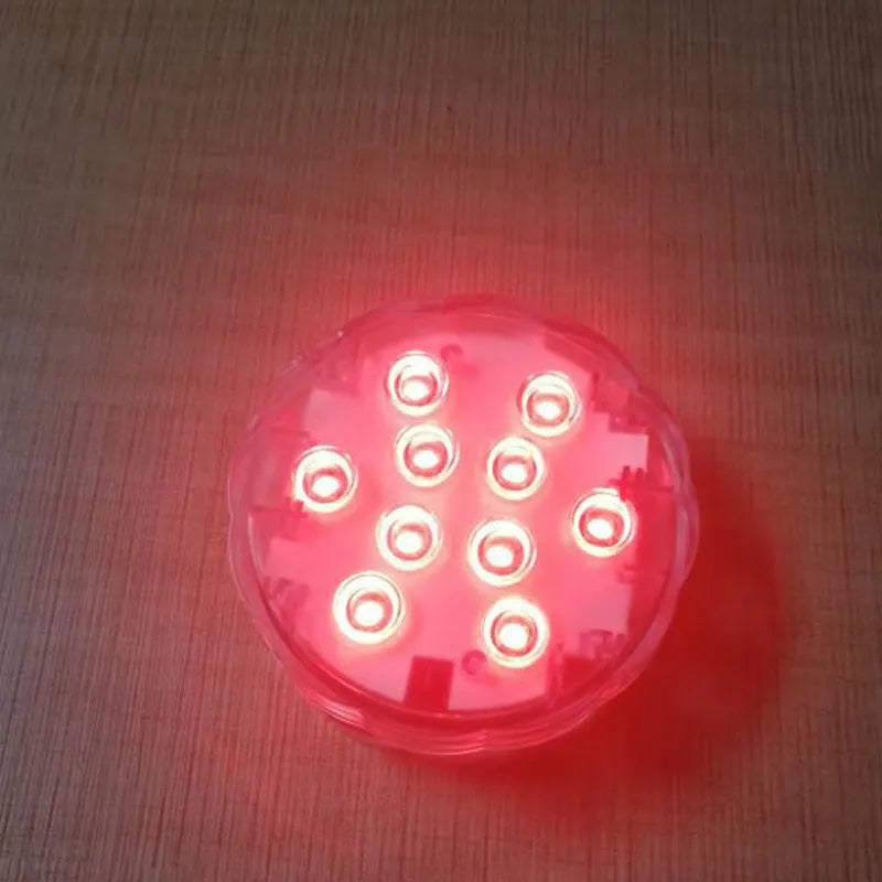 White waterproof LED light with remote control for pool and garden decoration.