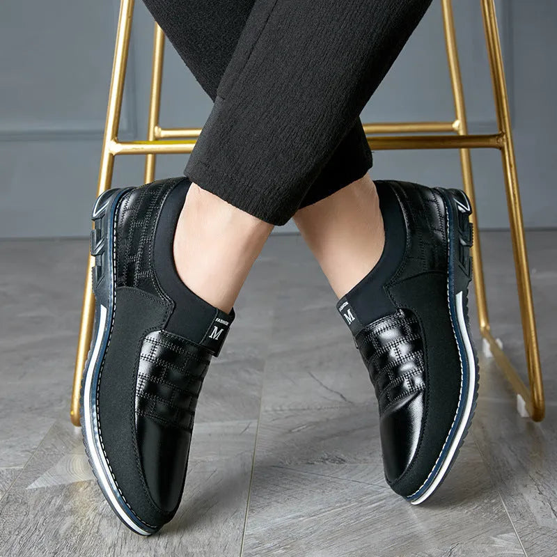 Men's blue imitation leather low-top casual shoe shown on a size chart background.