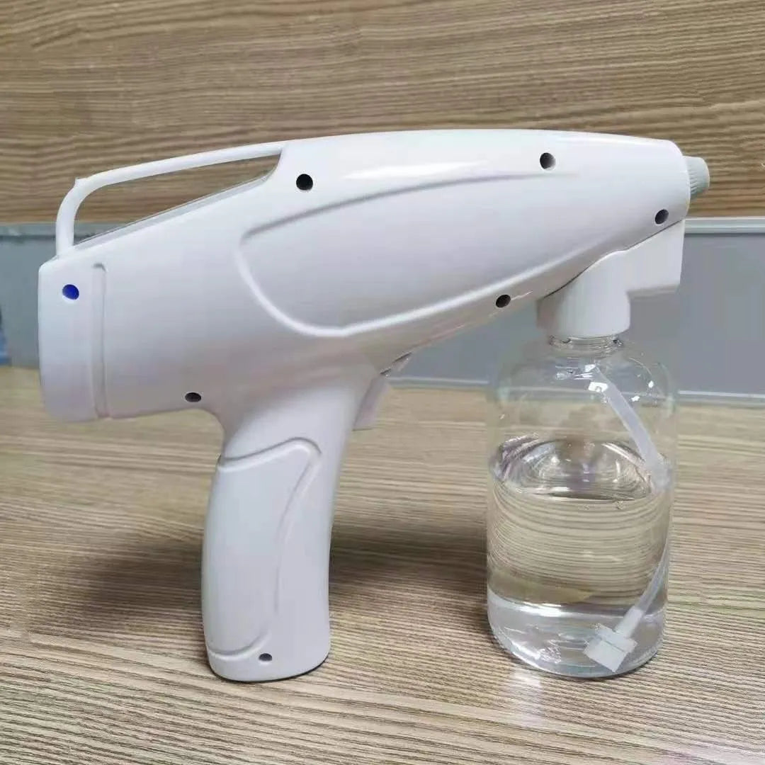 White handheld cordless electric disinfection spray gun with USB-C charging port.