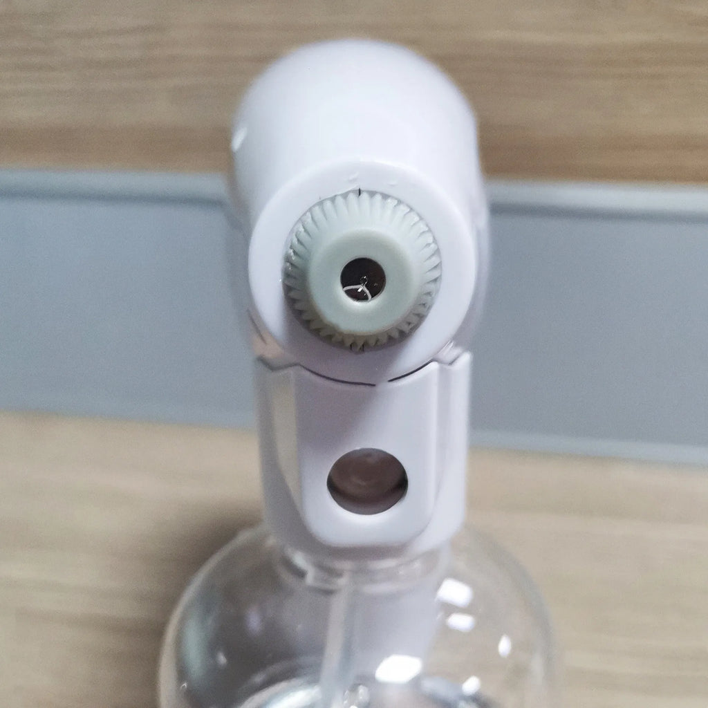 White handheld cordless electric disinfection spray gun with USB-C charging port.