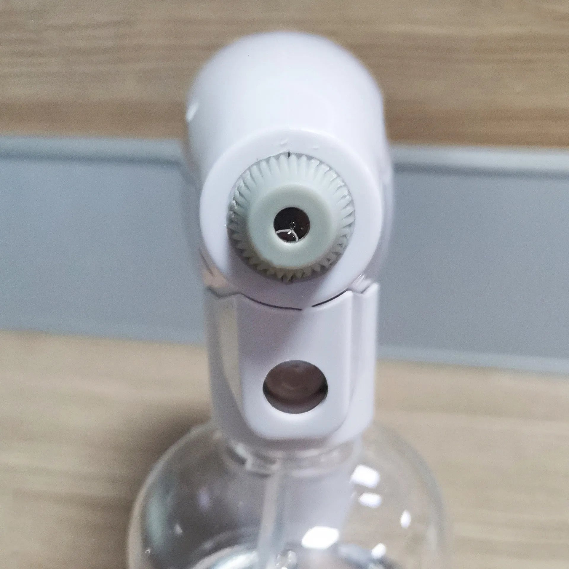 White handheld cordless electric disinfection spray gun with USB-C charging port.